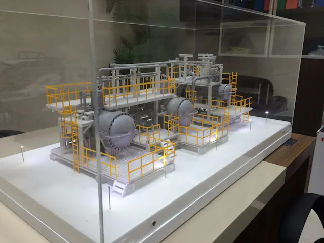 Scale model of a gas processing plant with vessels, piping and safety walkways, 3D printed by Orbit3D and displayed in an acrylic case